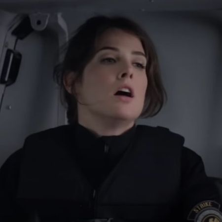 Cobie Smulders is in the armed cop uniform.